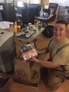 soldier opening his box and smiling