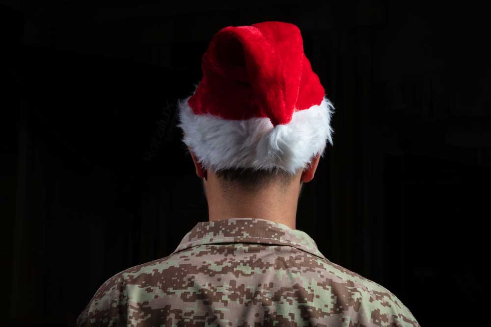 rear view of soldier wearing a santa hat