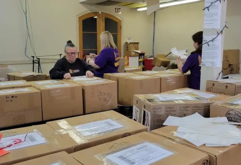 volunteers preparing care packages for br soldier outreach