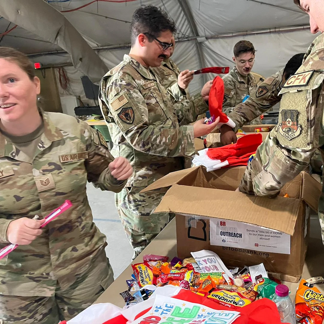 air force personnel opening brsoldier outreach care package box