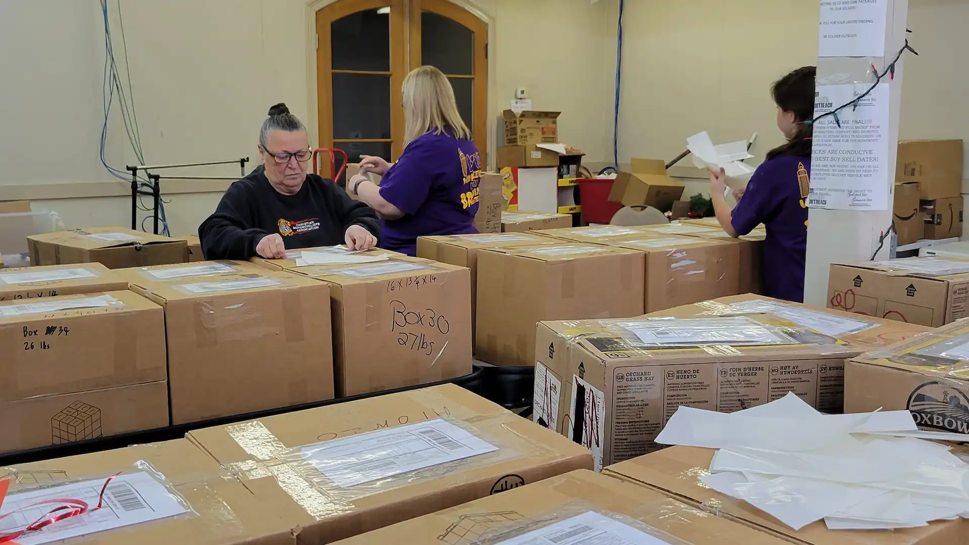 br soldier outreach volunteers packaging care packages.webp