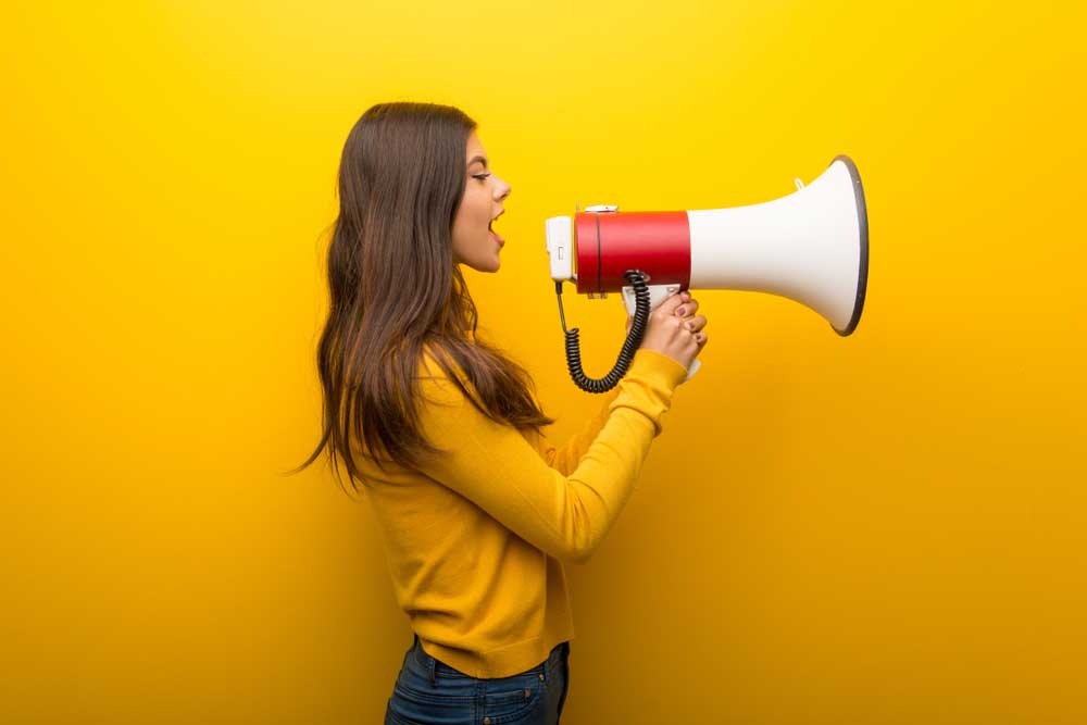 lady with megaphone making an announcement
