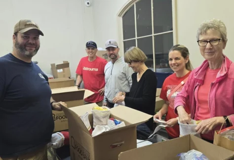volunteers packing care packages for br soldier outreach